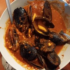 A picture of Mussels in Tomato Soup.