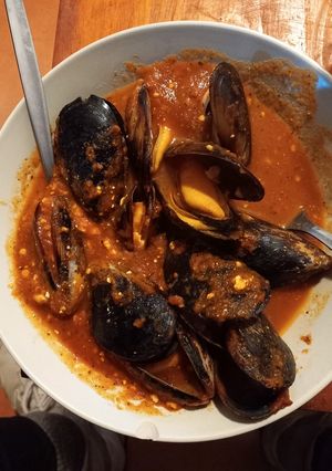 A picture of Mussels in Tomato Soup.