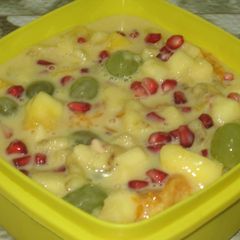 A picture of Fruit salad with custard.