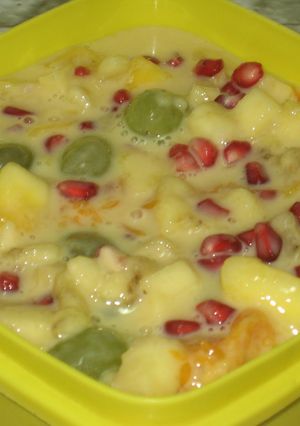 A picture of Fruit salad with custard.