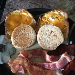 A picture of Peek a Boo Eggs with Ham and Cheese.
