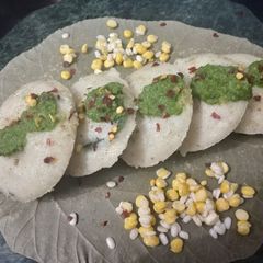 A picture of Rava idli with dahiya pudina chutney.
