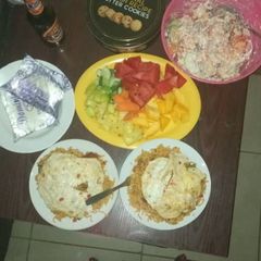 A picture of Noodles/ Fried eggs and fruit salad.