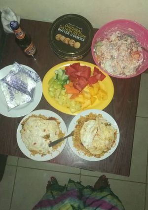 A picture of Noodles/ Fried eggs and fruit salad.