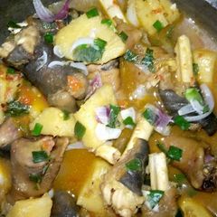 A picture of Goat legs and yam pepper soup.