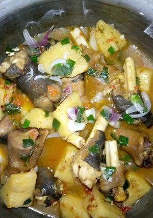 A picture of Goat legs and yam pepper soup.