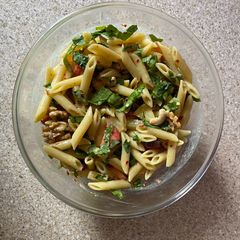 A picture of Pasta fruit and nuts salad.