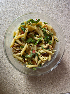 A picture of Pasta fruit and nuts salad.