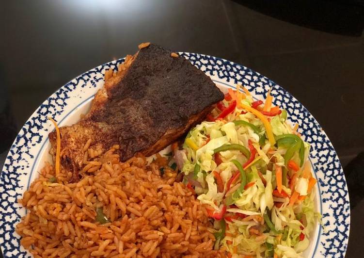 Jollof rice, fresh veggie salad with Salmon