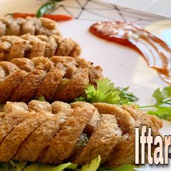 A picture of Bread roll with potato stuffing.