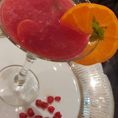 Tangerine & pomegranate mocktail A picture of Tangerine & pomegranate mocktail.