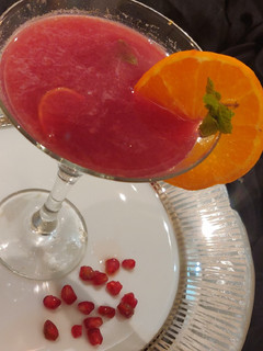 A picture of Tangerine & pomegranate mocktail.