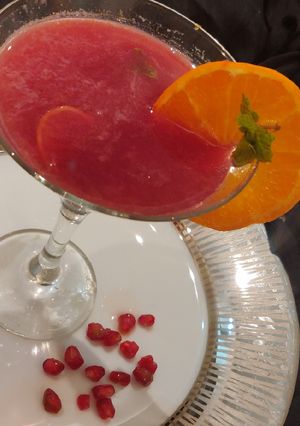A picture of Tangerine & pomegranate mocktail.