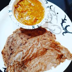 A picture of Oats Ragi Dosa with Sambar.
