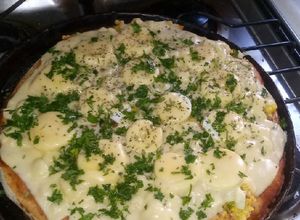 Una foto de Pizza graneada