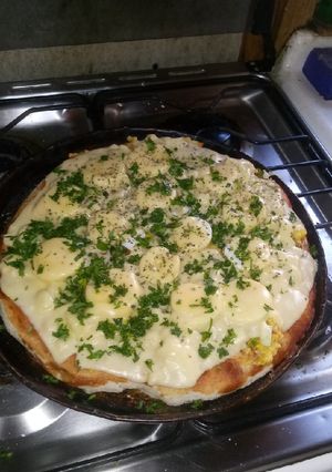 Una foto de Pizza graneada