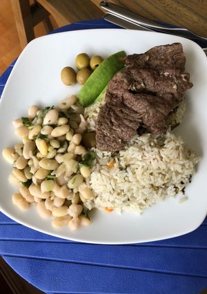 Una foto de Porotos con cebolla