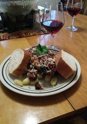 A picture of Italian Olive Chicken and Peppered Gnocchi.