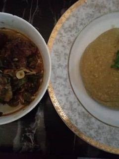 A picture of Goatmeat peppersoup with garri.