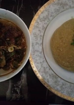A picture of Goatmeat peppersoup with garri.