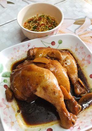 A picture of Chicken Boiled in Fish Sauce with Three-Flavored Dipping Sauce.