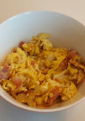 A picture of Bacon, eggs and chili.