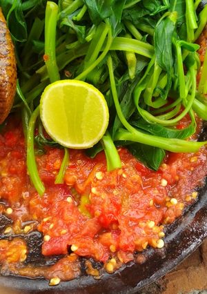 A picture of Plecing Kangkung with Lime Sambal.