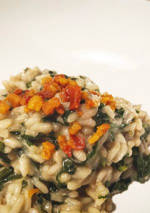 Foto di Risotto con tarassaco e bacon croccante