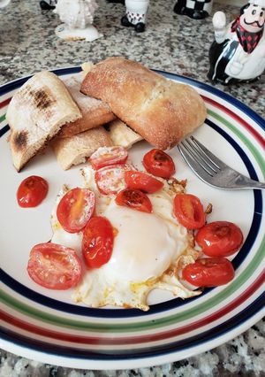 A picture of Egg 🥚 with tomatoes 😋.