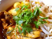 A picture of spring onion and peanuts