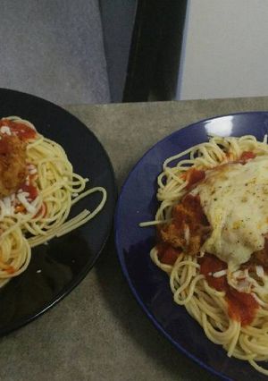 A picture of Chicken Parmesan w/ Spaghetti.