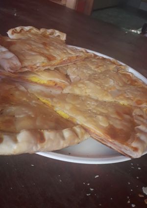 Una foto de Tarta de paleta, queso y huevos