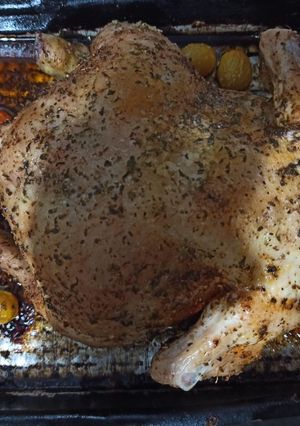 Una foto de Pollo al horno con tomates cherry y miel