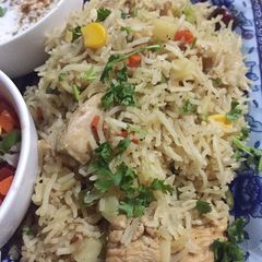 A picture of Chicken vegetables rice.