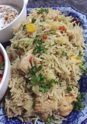 A picture of Chicken vegetables rice.