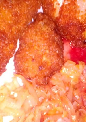 A picture of Marinated chicken with tomato sauce.
