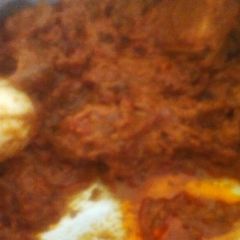 A picture of Beef biriyani with eggs.