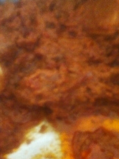 A picture of Beef biriyani with eggs.