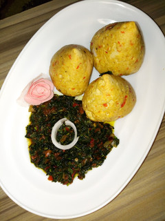 A picture of Tofu(Awara) moi moi served with veggie sauce.