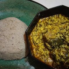 A picture of Egusi and millet swallow.