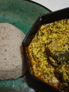 A picture of Egusi and millet swallow.