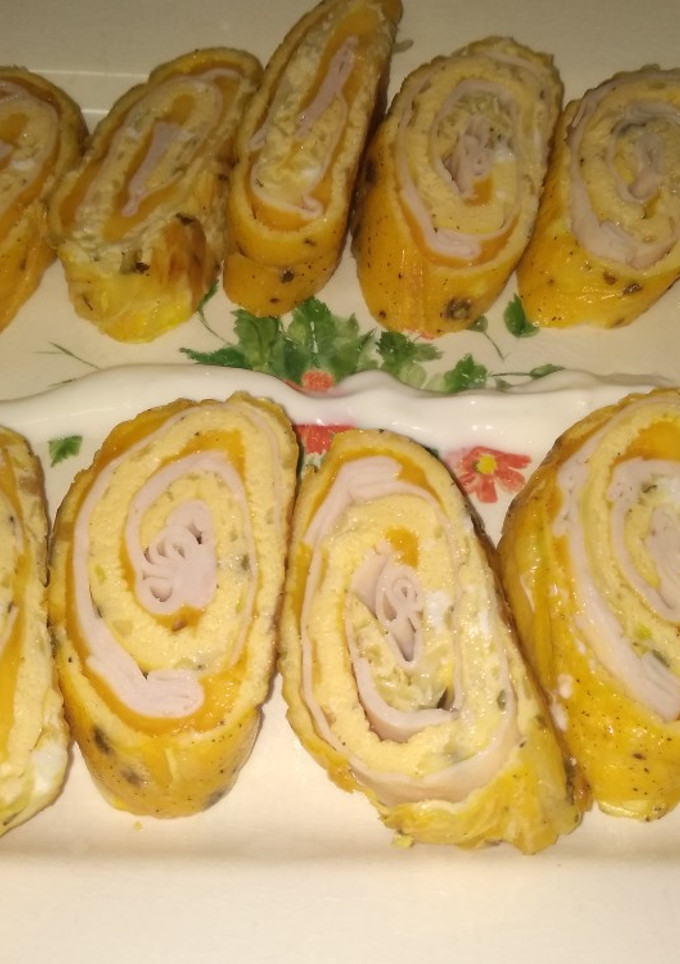 Una foto de Rollo de tortilla de calabacín relleno
