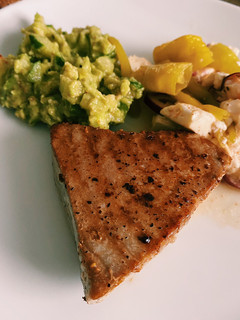 A picture of Tuna steak with cucumber guacamole.