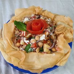 A picture of Chana chat in crisp bowl.