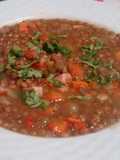 Sopa de lentejas con chuleta ahumada