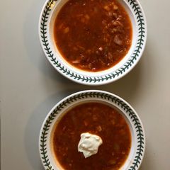 A picture of Tinned Tomato, Red Onion & Red Lentil soup (with ham stock & bits or vegetarian alternative).