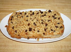 Una foto de BREAD PUDDING WITH WALNUTS AND RAISIN TOPPING. JON STYLE
