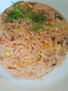 Una foto de Arroz rojo con Maíz