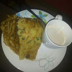 A picture of Vegetable pancake and tea.