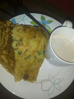 A picture of Vegetable pancake and tea.